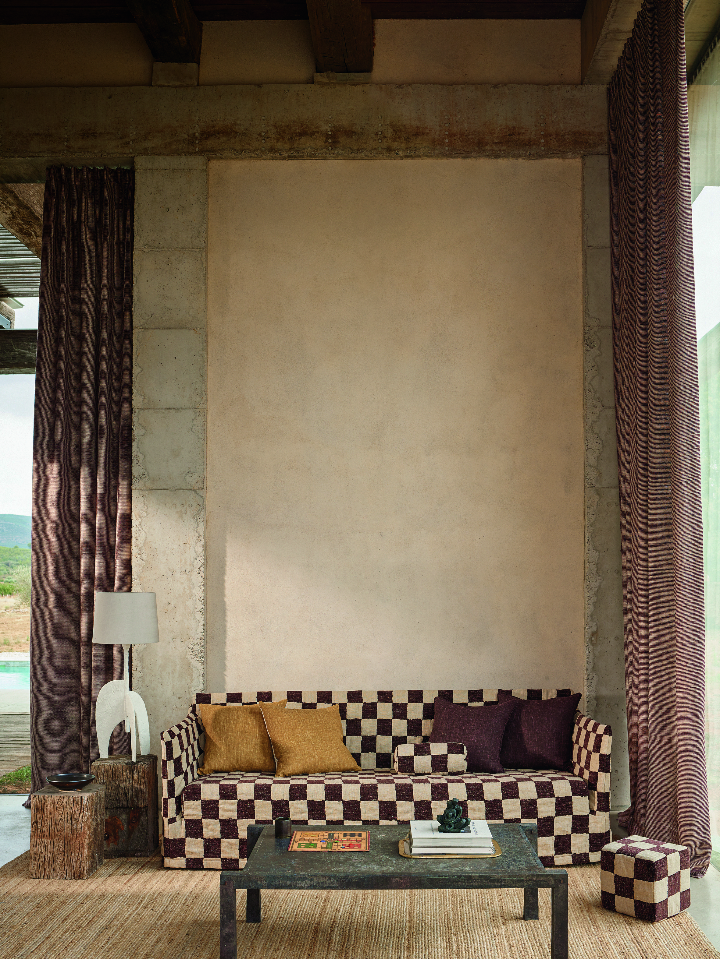 Checkerboard print sofa with matching stool