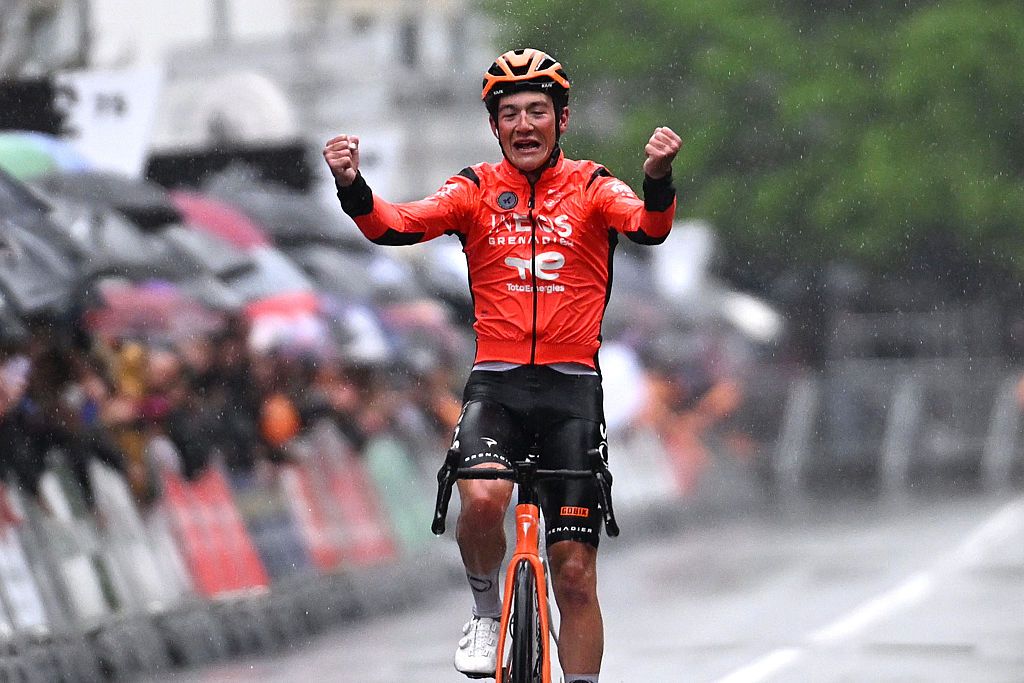 Andrew August of United States and Team INEOS Grenadiers celebrates at finish line as stage winner