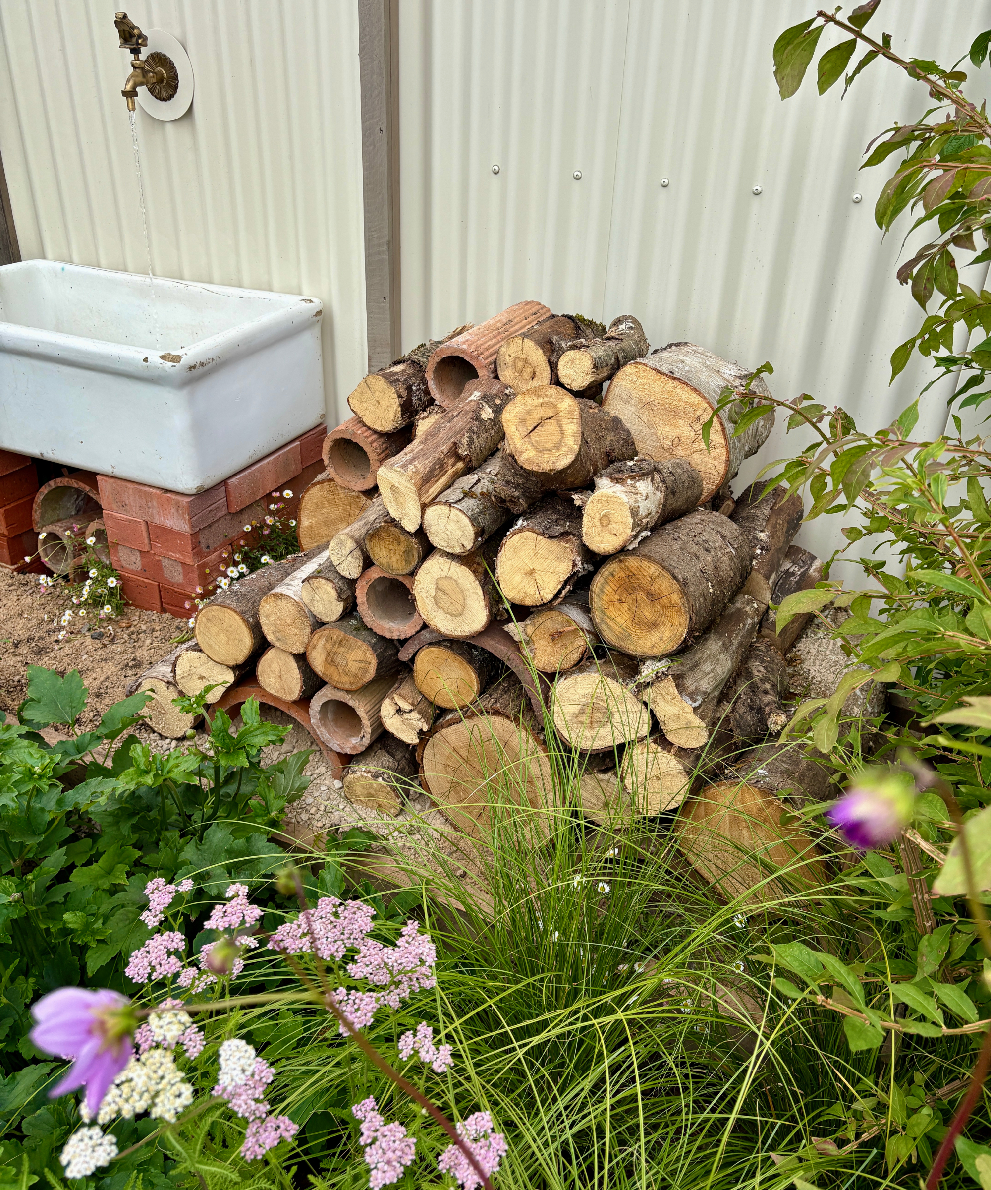 bug hotel made of stacked logs