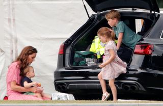 WOKINGHAM, UNITED KINGDOM - JULY 10: (EMBARGOED FOR PUBLICATION IN UK NEWSPAPERS UNTIL 24 HOURS AFTER CREATE DATE AND TIME) Catherine, Duchess of Cambridge, Prince Louis of Cambridge, Princess Charlotte of Cambridge and Prince George of Cambridge attend the King Power Royal Charity Polo Match, in which Prince William, Duke of Cambridge and Prince Harry, Duke of Sussex were competing for the Khun Vichai Srivaddhanaprabha Memorial Polo Trophy at Billingbear Polo Club on July 10, 2019 in Wokingham, England. (Photo by Max Mumby/Indigo/Getty Images)