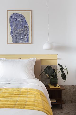bedroom with yellow accents at the social athens