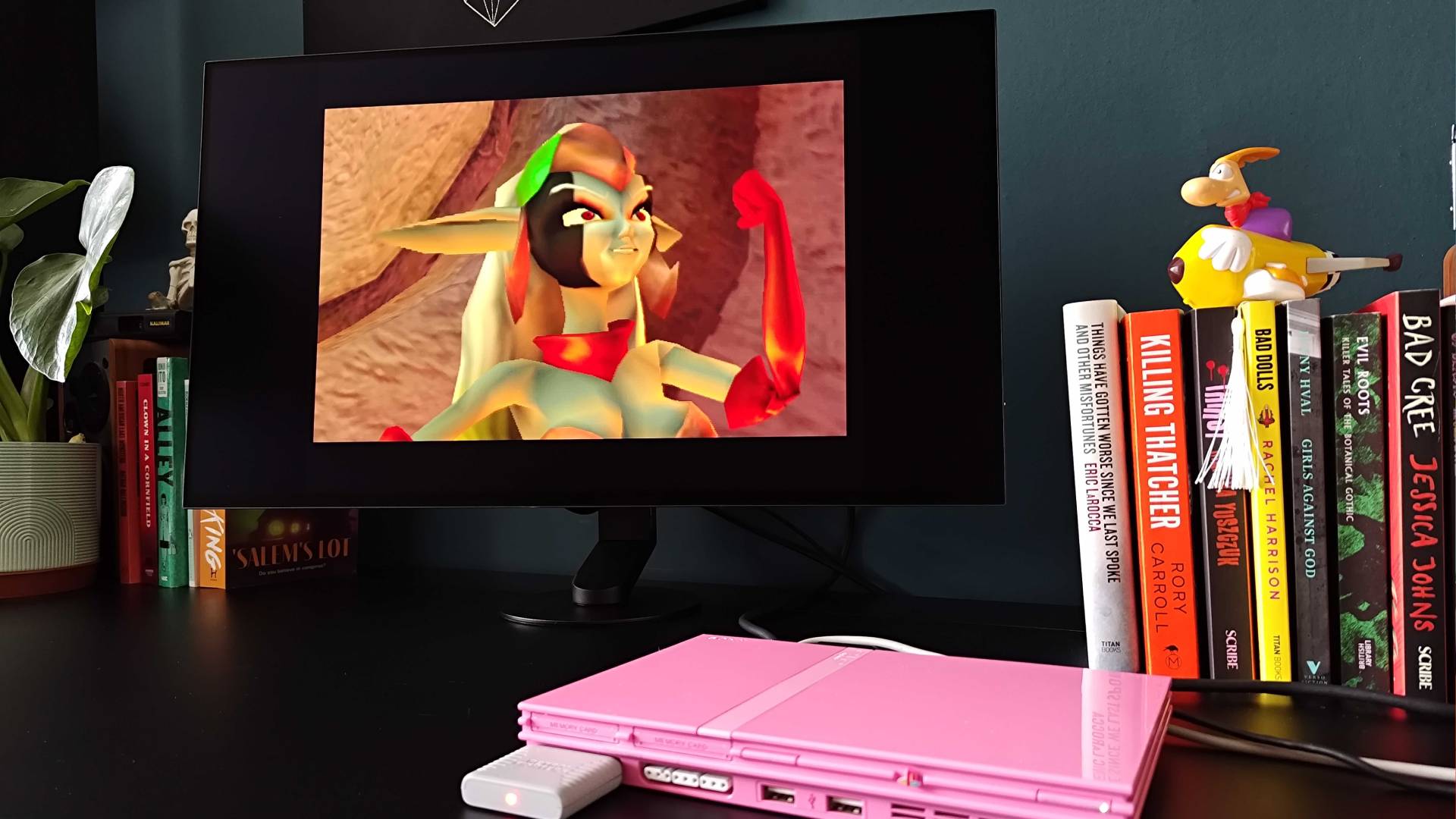 Sony Inzome M10S II with Jak and Daxter cutscene on screen running on pink PS2 slim.