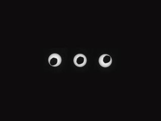 The Mars rover Curiosity took these images of an annular, or ring, eclipse as Mars' largest moon, Phobos, passed directly in front of the sun on Aug. 20, 2013. The photos were taken 3 seconds apart.