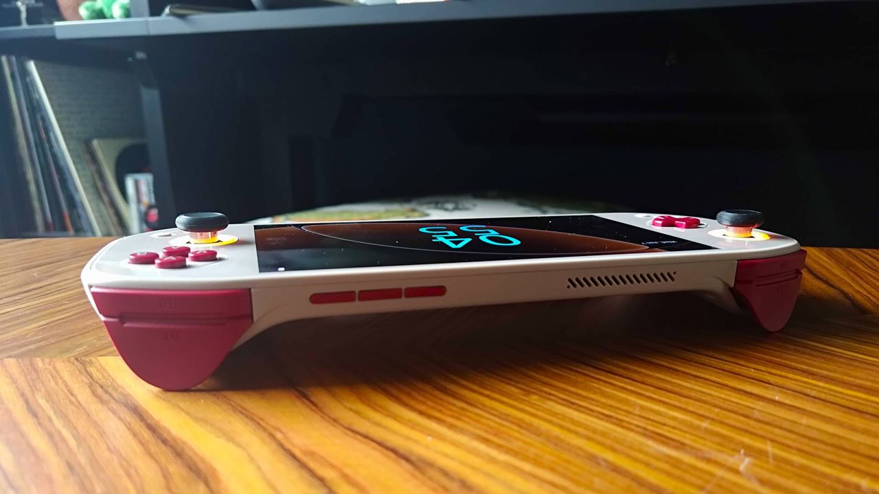 Top view of Mangmi Pocket Max triggers and ports on woodgrain table.