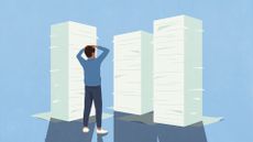 Overwhelmed office worker holding hands on their head while looking at three towering piles of paperwork.
