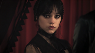 Wednesday staring into the camera at gala in Wednesday Season 2