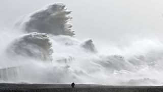 Waves crashed over Newhaven Harbor wall in Newhaven, southern England on Feb. 18, as Storm Eunice brought high winds across the country. Powerful storms such as this are becoming more frequent due to human induced climate change. 