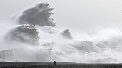 Waves crashed over Newhaven Harbor wall in Newhaven, southern England on Feb. 18, as Storm Eunice brought high winds across the country. Powerful storms such as this are becoming more frequent due to human induced climate change.
