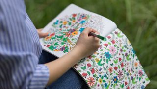 woman with colouring book