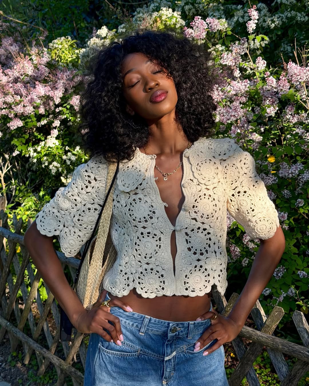 Emmanuelle in a crochet-style top