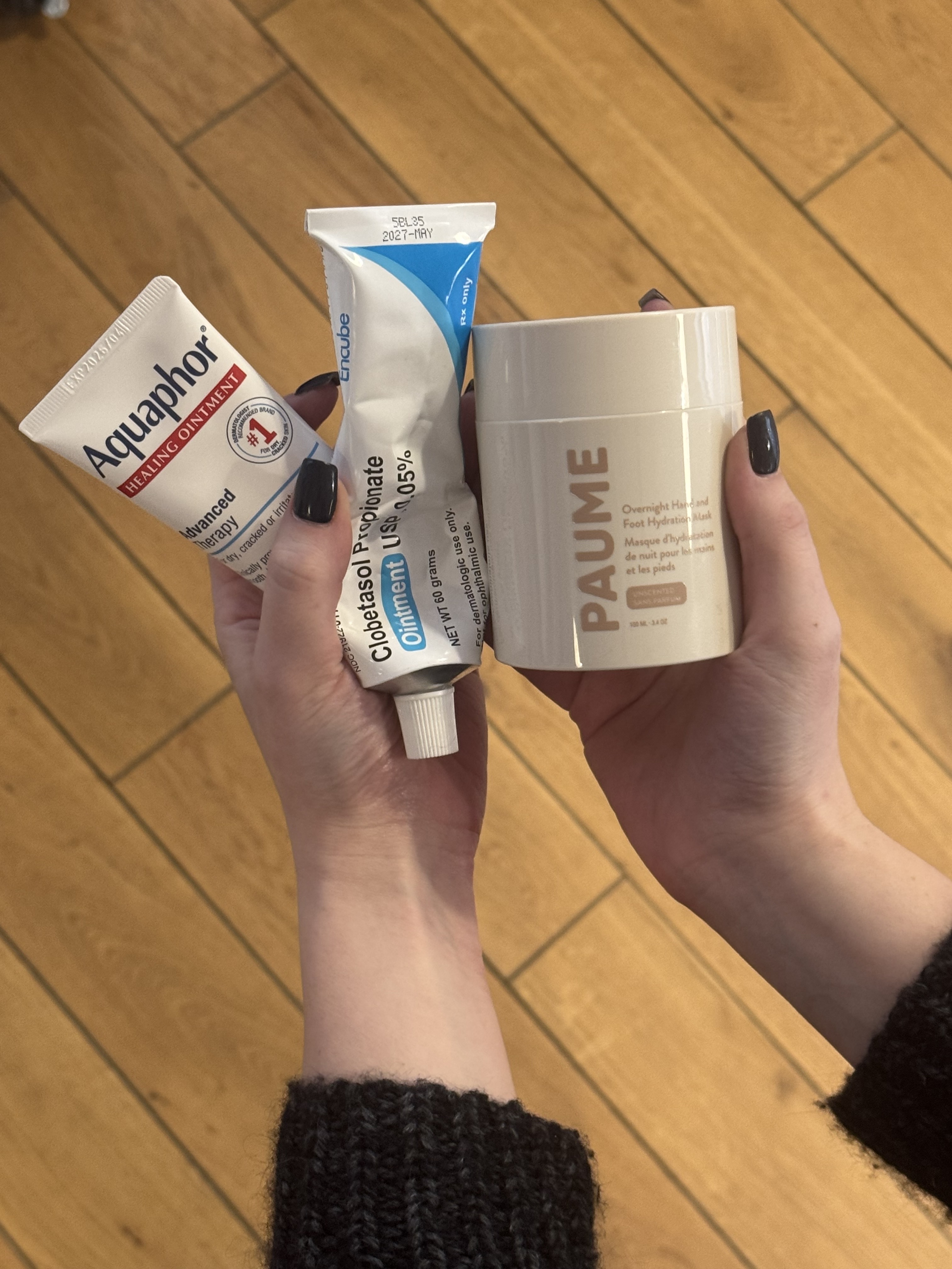 samantha holender holding three dry hand treatments