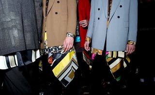 Males models wearing blue, grey, tan and red jackets over bright patterned shirts from the Cerruti 1881 SS2015 collection