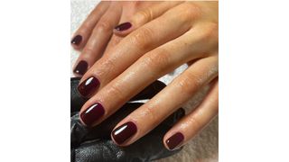 Squoval nails in dark berry colour by Sophie Louise Martin