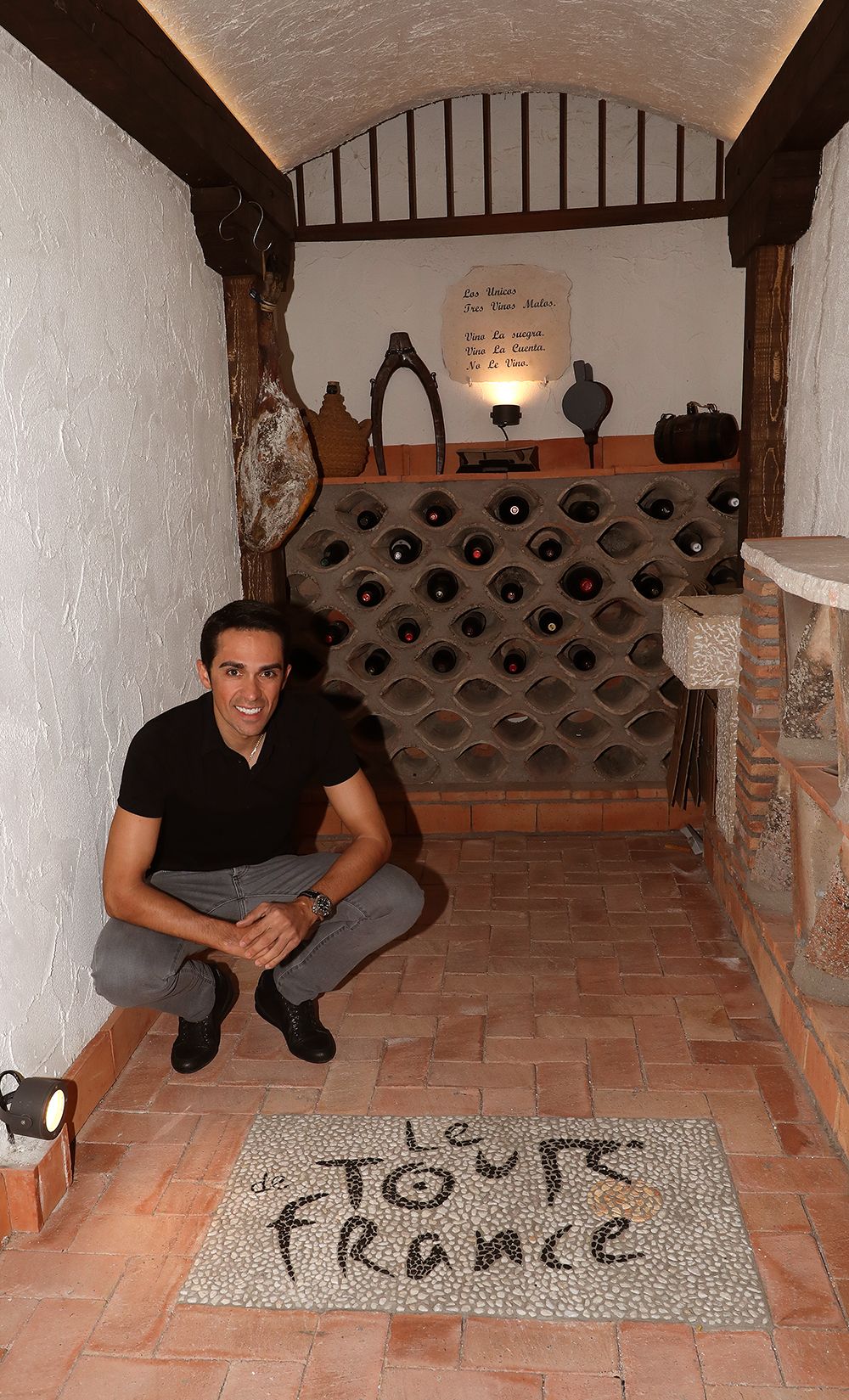 Contador has plaques on his floor of each of the three Grand Tours