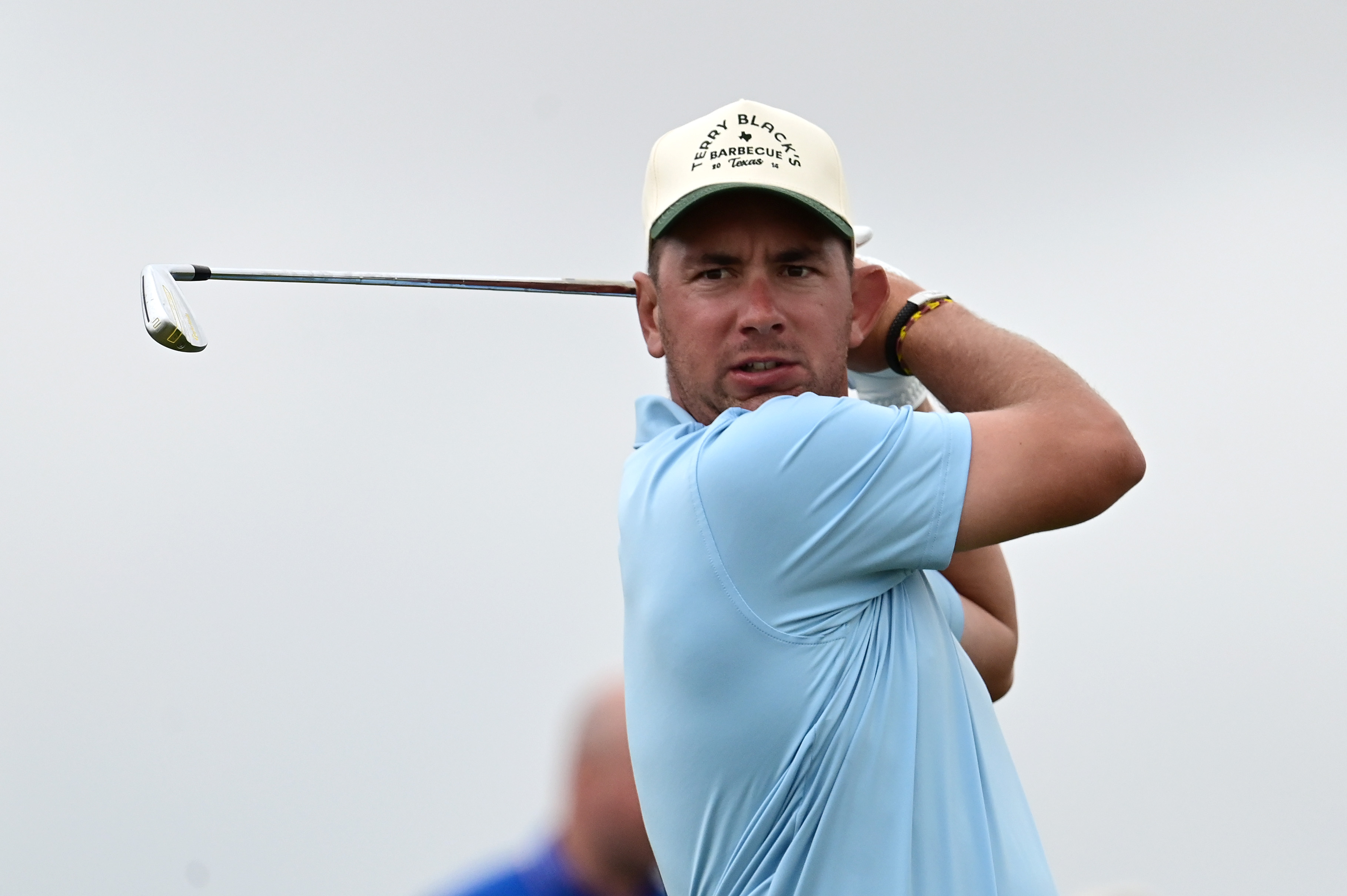 Lucas Herbert hits an iron shot