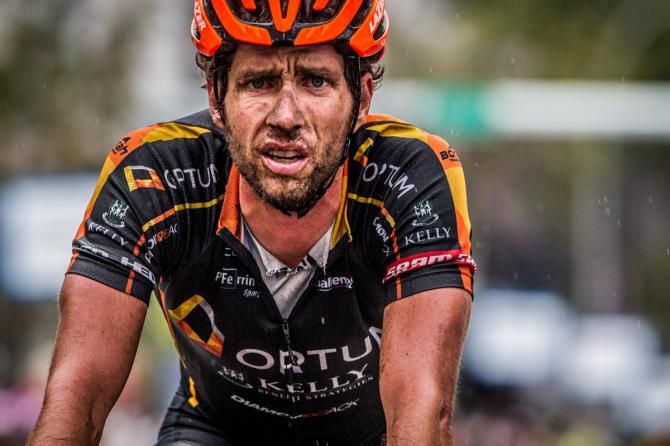 Scott Zwizanski (Optum) shows the wear of today's fast and wet race