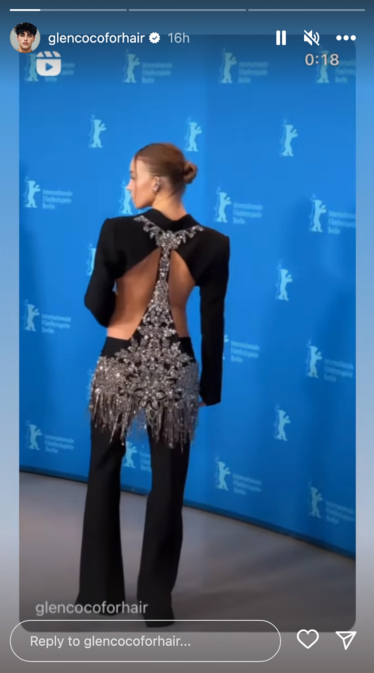 A screenshot from a video on Sydney Sweeney at the Berlin Film Festival, showing the back of her outfit.
