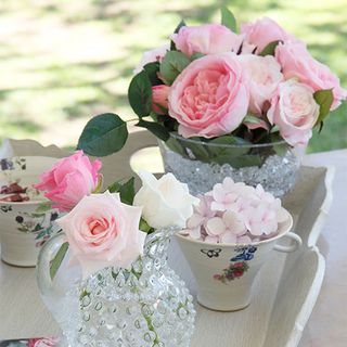 flower vases with rose flower in white tray
