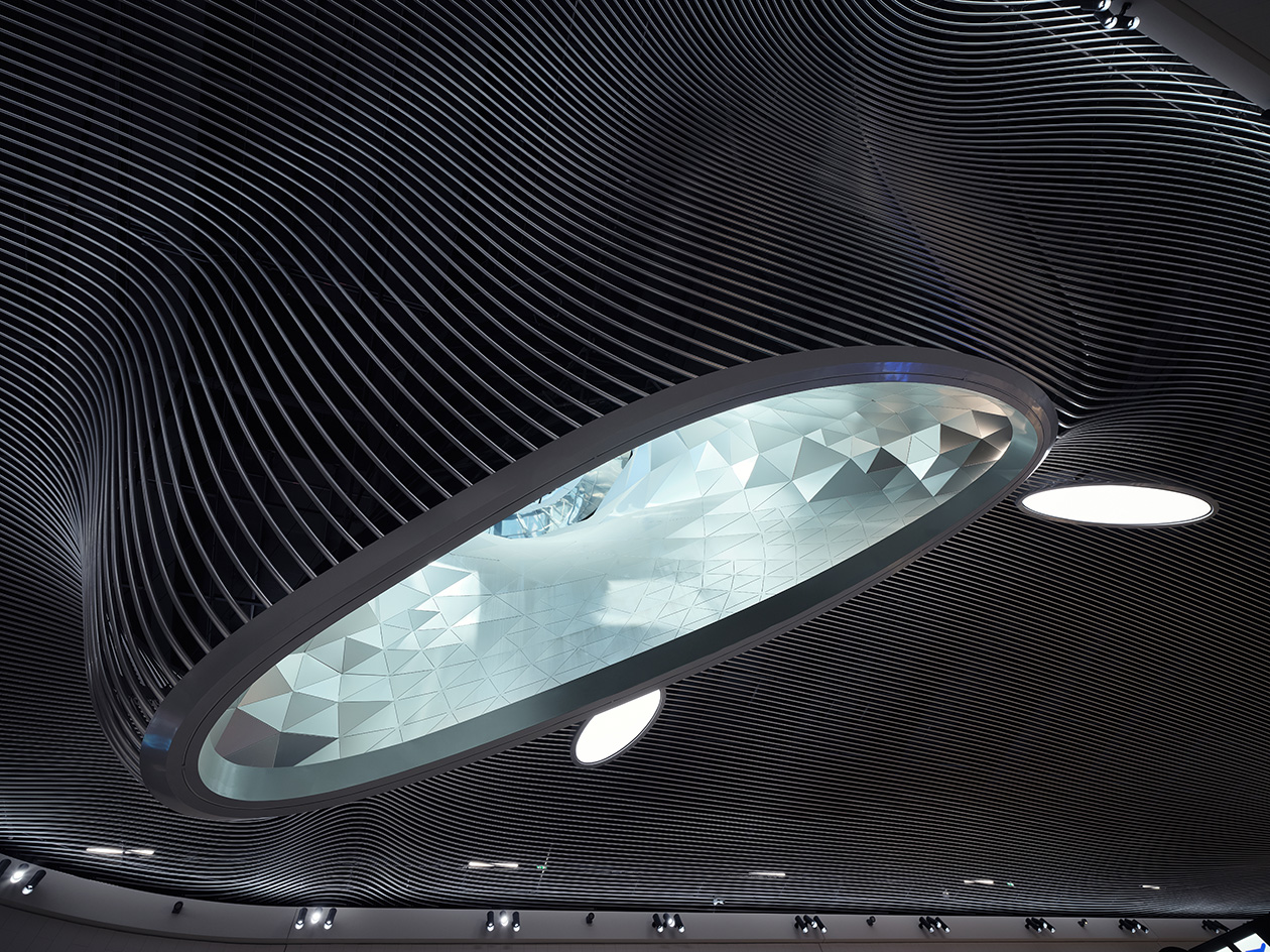 Frankfurt Airport interior The Marketplace, designed by LAVA, a flowing organic ceiling design with a skylight