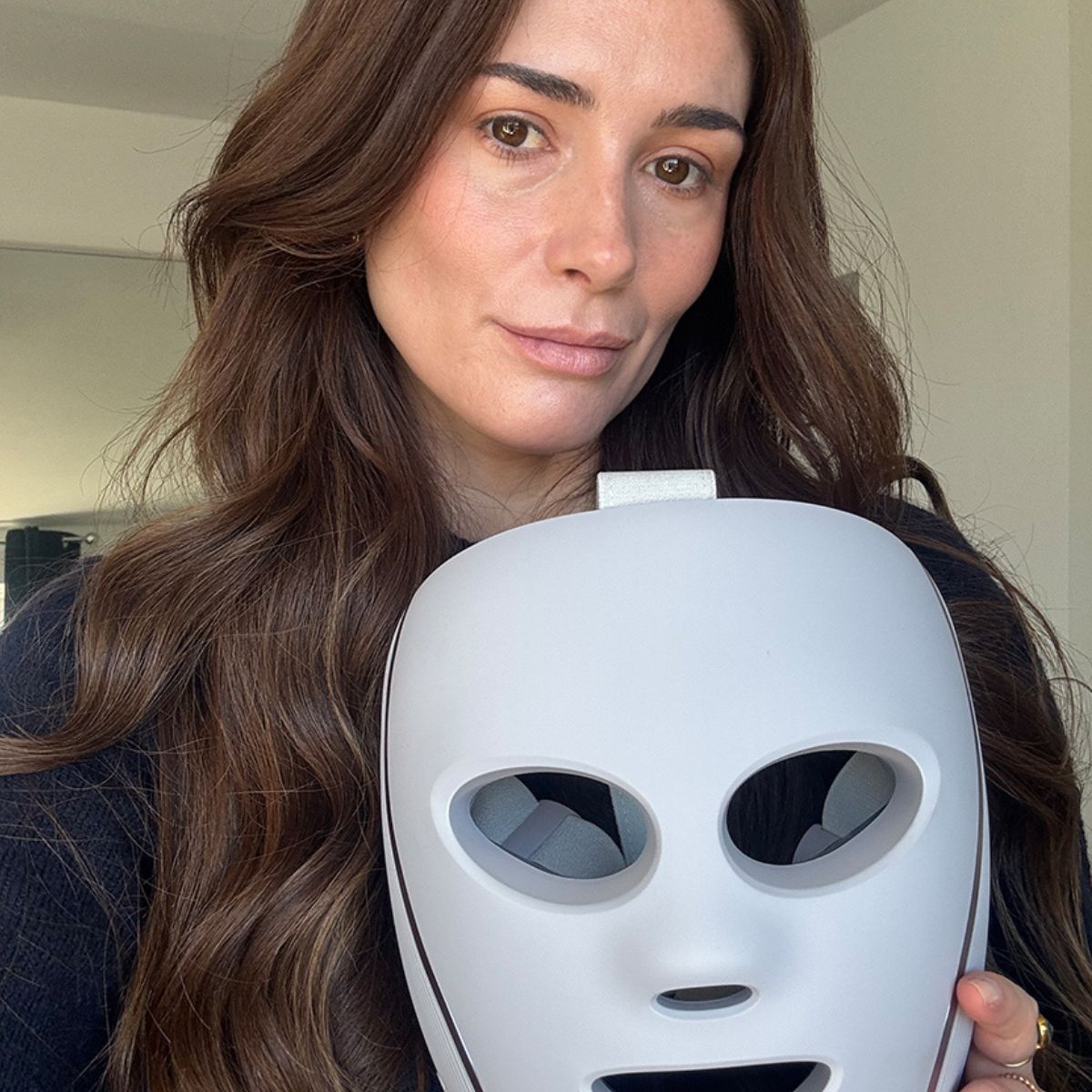 Eleanor holding the Shark LED mask