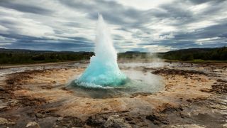 Strokkur geyser, Iceland, gushing blue water upwards