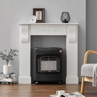 infrared heater built under mantelpiece in neutral grey living room