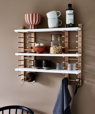 Ikea hack of using plate racks as kitchen shelving