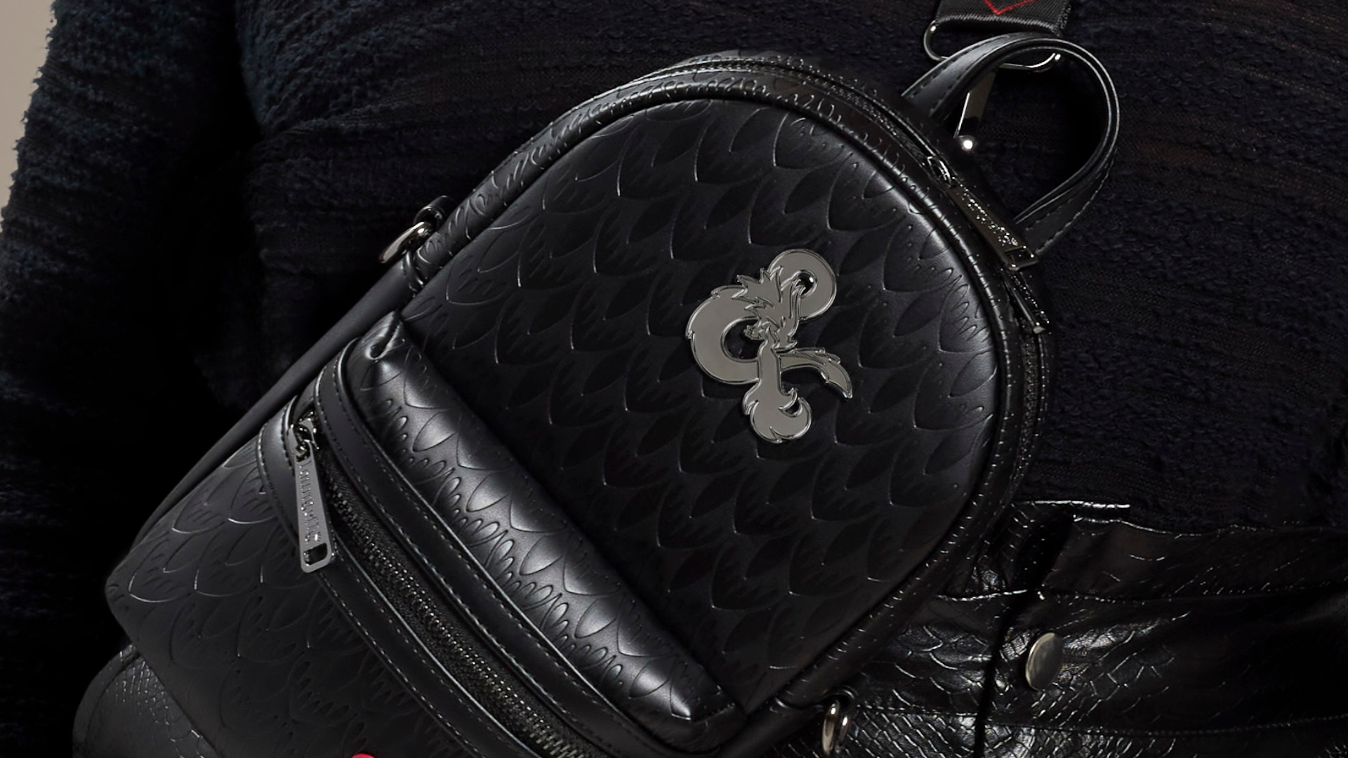Dungeons &amp;amp; Dragons Loungefly bag against black clothing