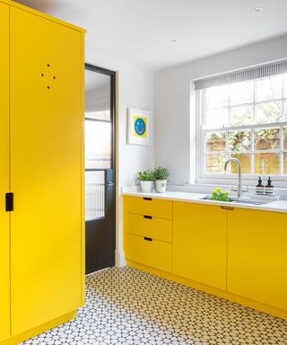 Entryway mudroom ideas with yellow cabinets