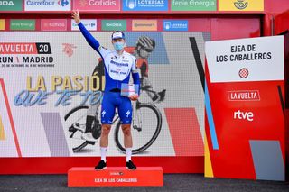 EJEADELOSCABALLEROS SPAIN OCTOBER 23 Podium Sam Bennett of Ireland and Team Deceuninck QuickStep Celebration Trophy Mask Covid safety measures during the 75th Tour of Spain 2020 Stage 4 a 1917km stage from Garray Numancia to Ejea de los Caballeros lavuelta LaVuelta20 La Vuelta on October 23 2020 in Ejea de los Caballeros Spain Photo by Justin SetterfieldGetty Images