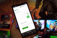 Xbox Support pages on an Xbox dashboard background