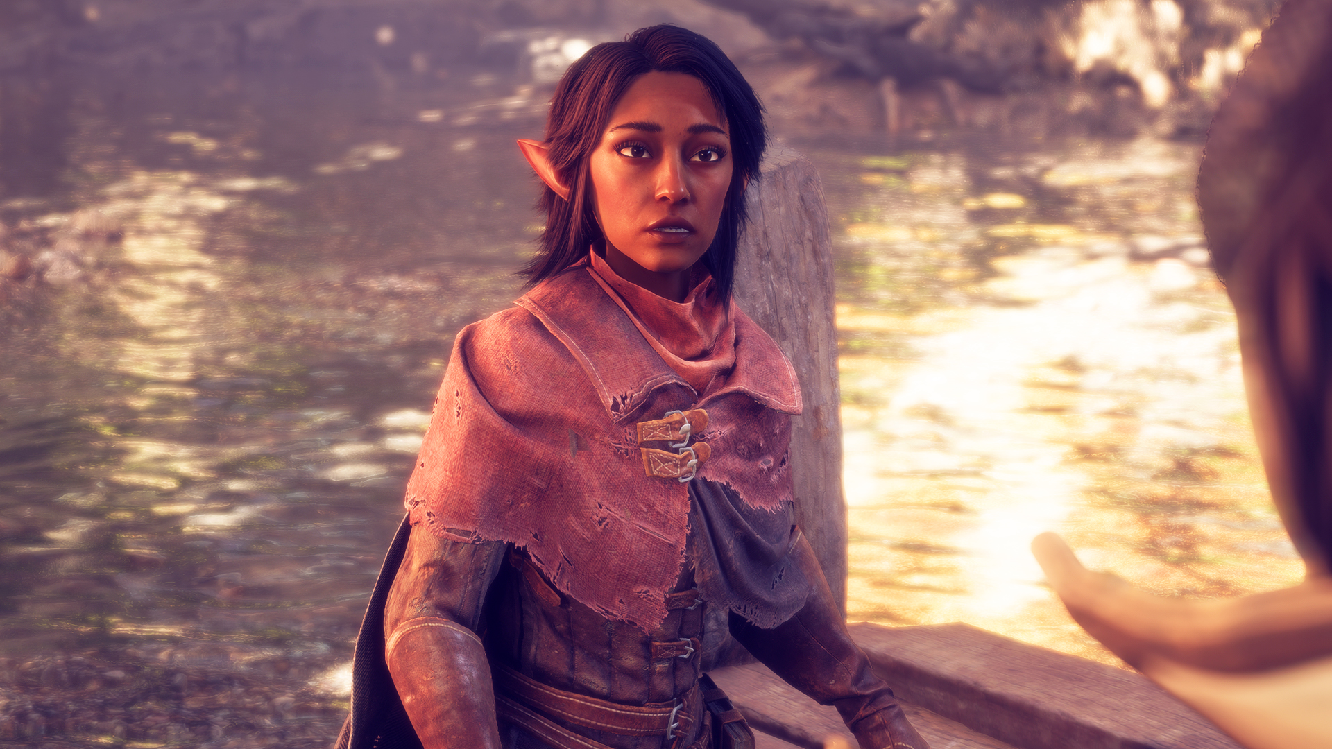 Dark-haired elf character looking towards another during a dialogue scene in Dragon Age The Veilguard