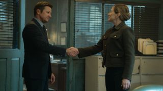 From left to right: Jeremy Renner shaking Edie Falco's hand.