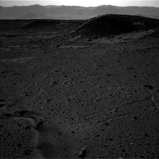 This image — captured by the left-side navigation camera on NASA's Mars Curiosity rover on April 3, 2014 — shows the same Martian locale where a bright flash seemed to appear that day in an image taken by the righthand navcam. Though the two navcam photos were taken at about the same time, no flash is visible in this one.