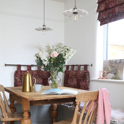 Bench and table nook in kitchen with pendant fluted lights