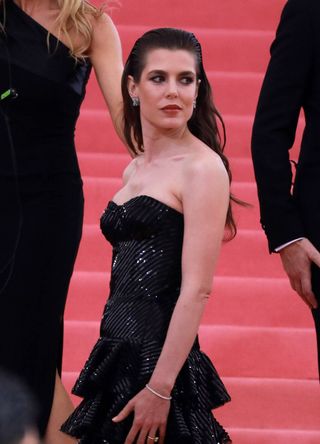 Charlotte Casiraghi on the Met Gala steps wearing a black sequin gown