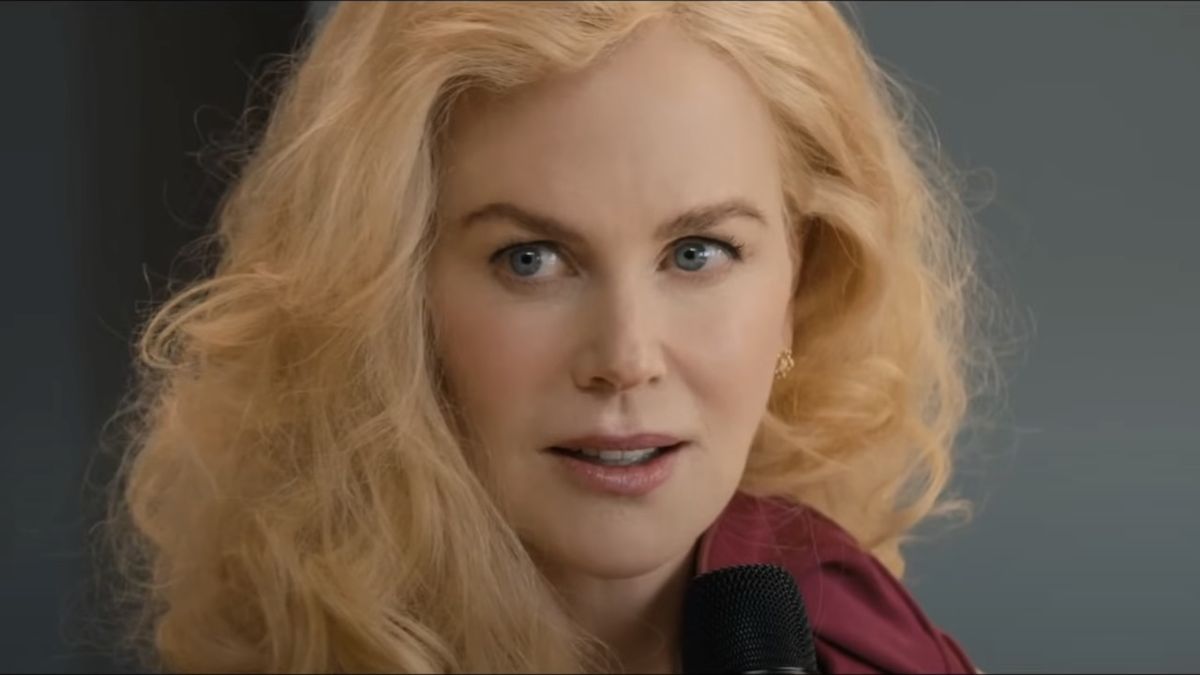 Nicole Kidman holding a microphone in The Perfect Couple