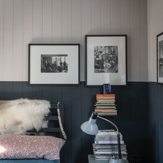 bed with table lamp and books