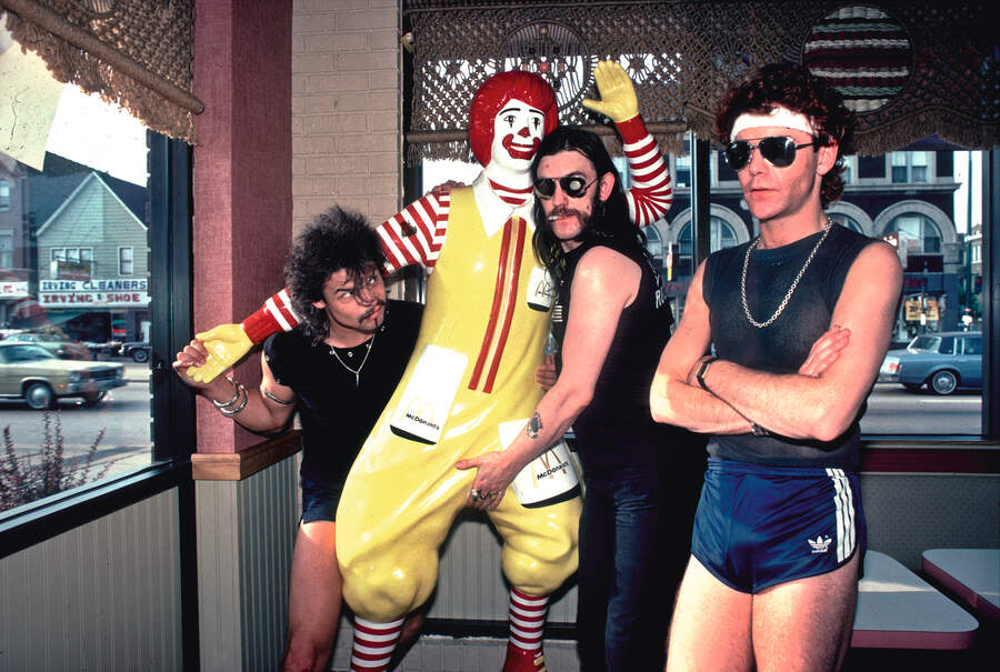 Mot&amp;ouml;rhead clowning around with a statue of Ronald McDonald at a McDonald's restaurant in Chicago, Illinois, August 5, 1983.
