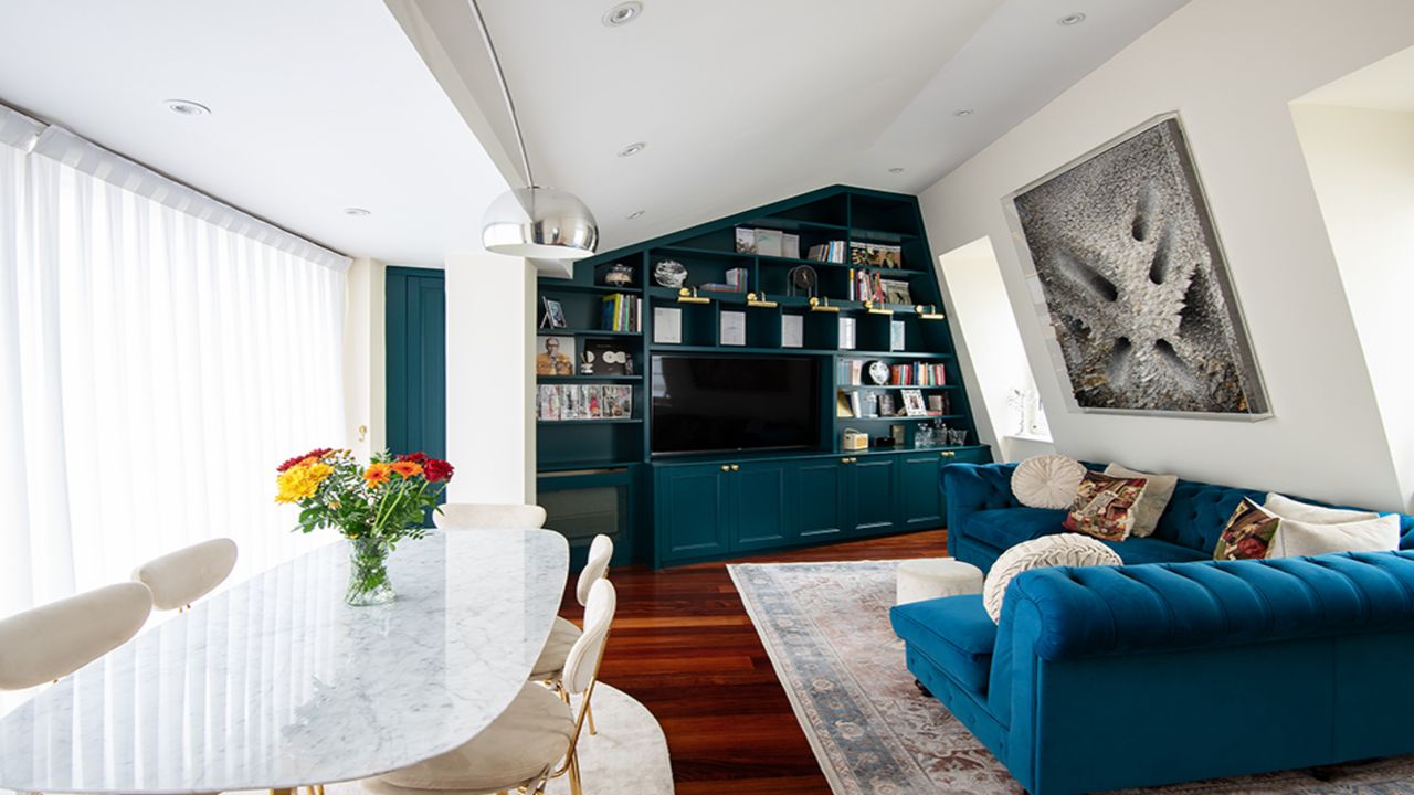 living room with blue bespoke shelving unit