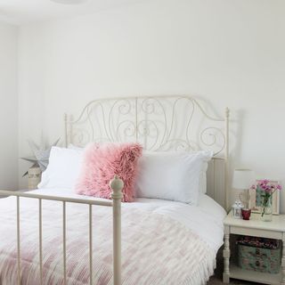 bedroom with white wall and bed