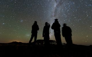 Four members of the South African observation team scan the sky while waiting for the start of the 2014 MU69 occultation, early on the morning of June 3, 2017. They used portable telescopes to observe the event, as MU69, a small Kuiper Belt object and the next flyby target of NASA’s New Horizons spacecraft, passed in front of a distant star.