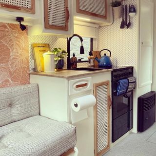 caravan kitchen with rattan and wallpaper