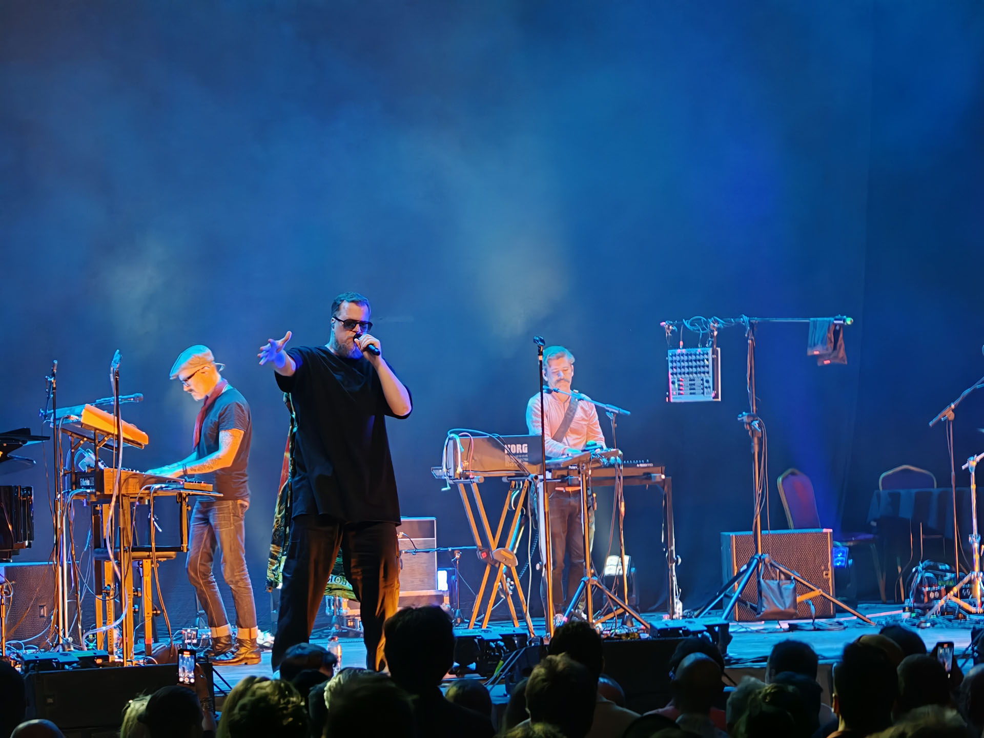A photo of John Grant playing live.