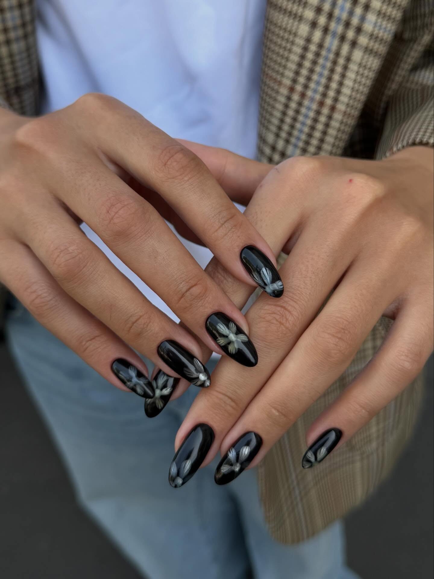 black and floral nail design