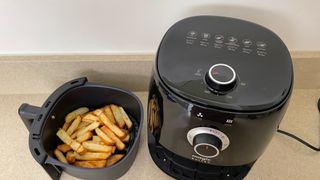 Magic Bullet Air Fryer and tray of air-fried fries