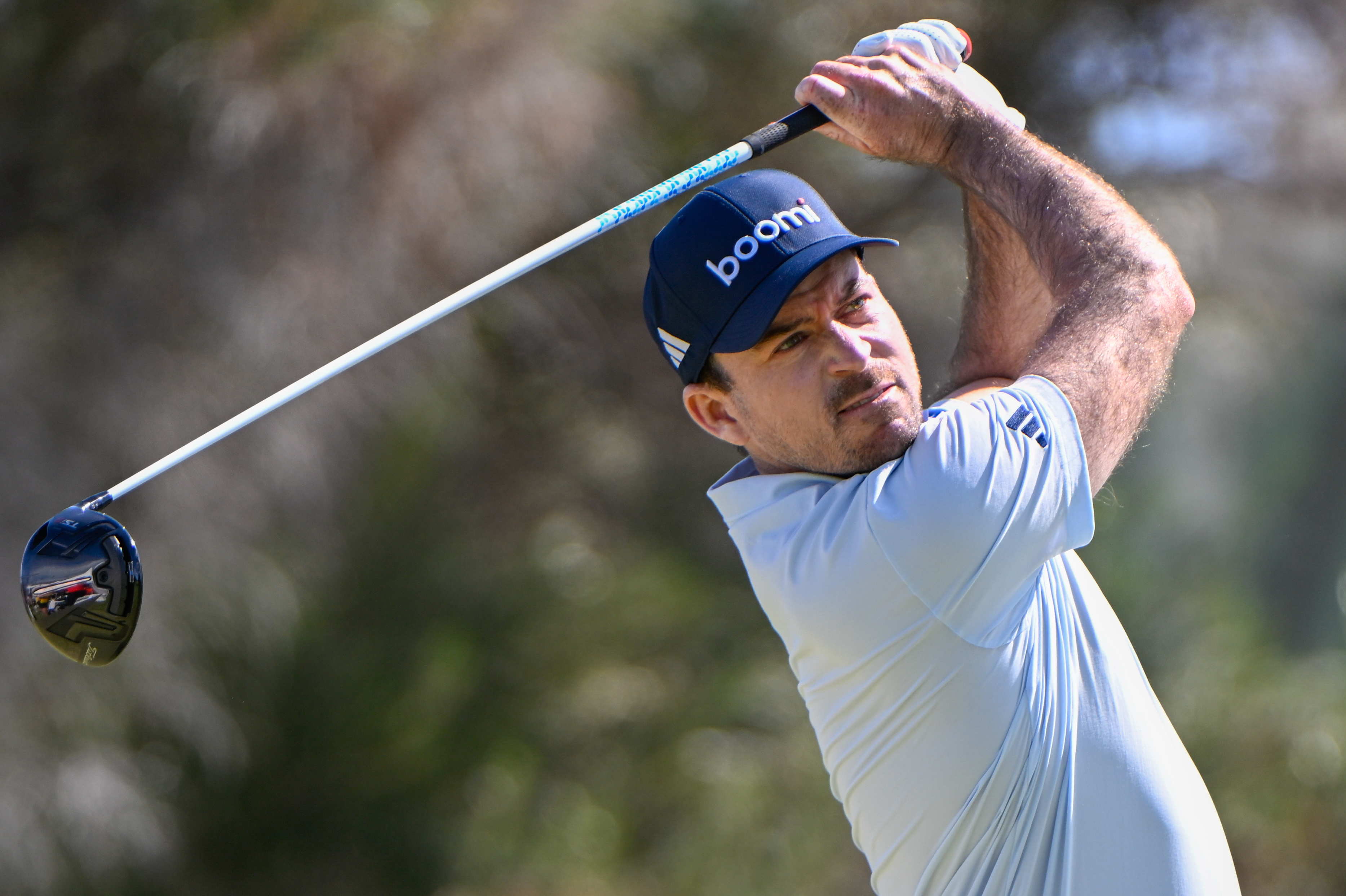 Nick Taylor hits a driver off the tee
