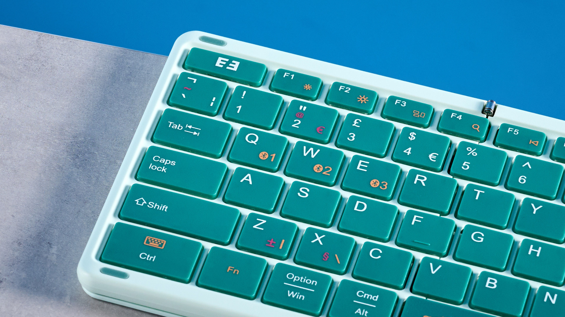 Seenda Foldable Bluetooth Keyboard with Touchpad pictured in front of a blue background.