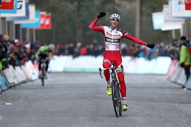 A triumphant Klaas Vantornout celebrates his Belgian 'cross title