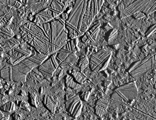 On Europa, "chaos terrains" consist of regions where the icy surface appears to have broken apart, the broken pieces moved around, and then those pieces froze back together.